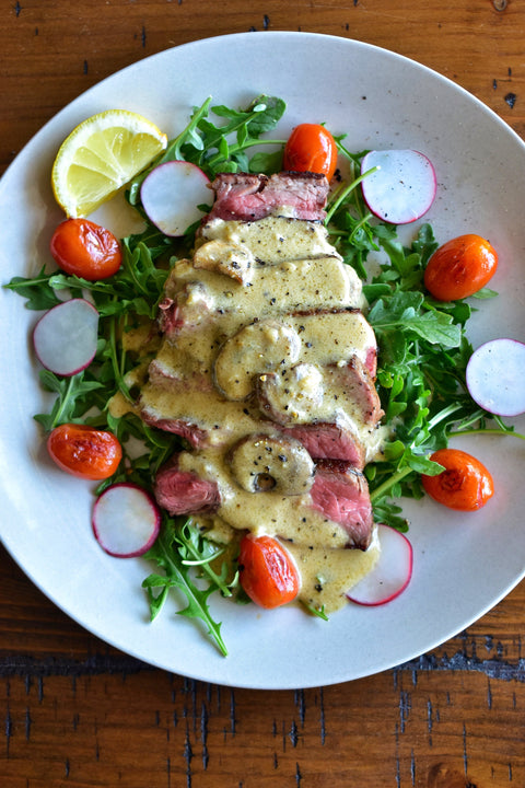 Seared Top Sirloin Over Baby Arugula with Warm Creamy Peppercorn & Portobello Sauce