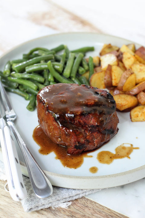 classic demi glace steak fillet with roasted potatoes and green beans